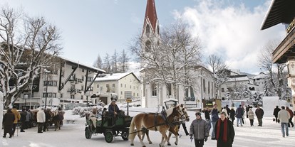 Golfurlaub - Österreich - Fußgängerzone Seefeld in Tirol - alpinen Lifestyle im Sommer wie im Winter genießen - Inntalerhof - DAS Panoramahotel