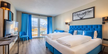 Golfurlaub - Terrasse - Igls - Deluxe Doppelzimmer in blau - Vitalhotel Kaiserhof