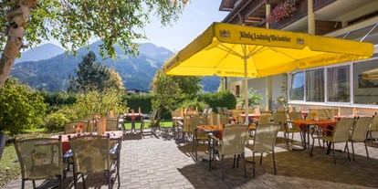 Golfurlaub - Umgebungsschwerpunkt: am Land - Reit im Winkl - Geniessen Sie die wunderbare Aussicht oder Ihre Mahlzeiten auf unserer Sonnenterrasse. - Hotel Alpenhof Brixen